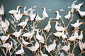 a wall decorated with paper cutouts of storks and babies