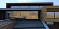 Wall decoration of an advanced country house. Facade board, multi-colored brick and concrete. The terrace is fenced with glass.