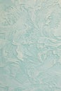 Wall with decorative venetian stucco of light green color. Luxury background. Vertical fragment