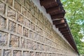 Wall of Deoksu palace in Korea with tiled stones and tranditional kiwa structure.