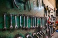 Wall with different metal instruments in little factory room