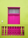 Wall. Door to balcony. Bright colors. Deep pink and yellow-green Royalty Free Stock Photo