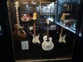 Wall with electric guitars of famous musicians in Cavern Club, Liverpool