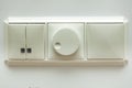 Wall electric light switch and dimmer switch Royalty Free Stock Photo