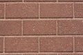 Wall of red granite bricks Royalty Free Stock Photo