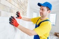 Wall facing work with brick by professional bricklayer worker