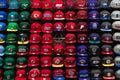 Wall full of team sport caps