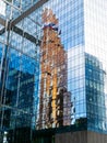 wall of glass tower with reflection of skyscraper Royalty Free Stock Photo