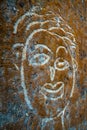 Wall graffiti, poker and happy faces made by scraping concrete wall. India Royalty Free Stock Photo