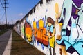 Wall with Graffitis along a Path