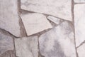 Wall with granite inserts background close-up. Stock photo wall facade with a granite daub