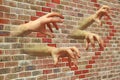 The wall has hands
