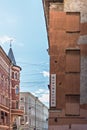 Wall of a house with false Windows with the inscription minimalism in the city