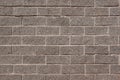 The wall of the house is lined with gray bricks. Used as a background. Royalty Free Stock Photo