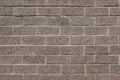 The wall of the house is lined with gray bricks. Used as a background. Royalty Free Stock Photo