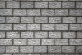 The wall of the house is made of gray concrete blocks. Aged background or wallpaper. The seams form a pattern similar to brickwork Royalty Free Stock Photo
