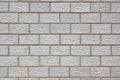 The wall of the house is made of gray concrete blocks. Background or wallpaper. The seams form a pattern similar to brickwork. Royalty Free Stock Photo