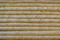Wall of a house made of natural wooden logs as a background Royalty Free Stock Photo