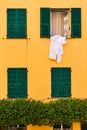 Wall of house with windows with shutters Royalty Free Stock Photo