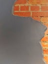 wall and interior design, orange brick wall with cement gray wall with copy space. wall texture and background. Royalty Free Stock Photo