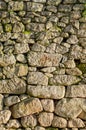 wall of irregular granite stone blocks, texture for backgrounds Royalty Free Stock Photo