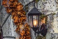 Wall lantern on stone with lights Royalty Free Stock Photo