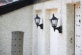 Wall lanterns on old house, perspective view
