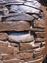 The wall of the large natural stone, painted brown paint Royalty Free Stock Photo