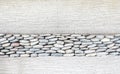 Wall layer with pebbles stone and cement,Texture background Royalty Free Stock Photo