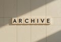 Wall Letters Spelling Archive on Minimalist Background in Natural Light Royalty Free Stock Photo