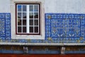 The wall is lined with tiled azuljozo on the terrace of the Mona