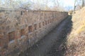 Wall with loopholes on down part of fortress Rocca D`Anfo with