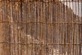 Wall made of cane and palm tree branches, natural mountain shelter in Wadi Shawka, United Arab Emirates