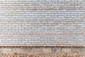 The wall is made of gray silicate bricks. Brickwork on the construction site of the house. Abstract construction texture