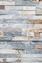 Wall made of marbled gray and brown stone bricks Royalty Free Stock Photo