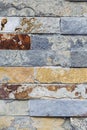 Wall made of marbled gray and brown stone bricks Royalty Free Stock Photo