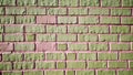 Wall made of mint and pink bricks. Texture of old colored brick wall Royalty Free Stock Photo