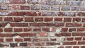 The wall is made of old red brick with a white coating on the surface Royalty Free Stock Photo