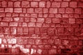 Wall made of old stones in red tone Royalty Free Stock Photo