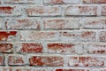 Wall made of red bricks cleaned of plaster for use in illustration design. Bricks partially covered with white plaster.