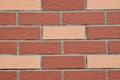 Wall made of red and pink bricks Royalty Free Stock Photo