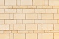 Wall made of smooth, rectangular yellow Sandstone blocks. Background image, texture