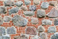 Wall made of stones and red bricks Royalty Free Stock Photo