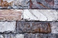 The wall is made of textured marble of different colors. Royalty Free Stock Photo