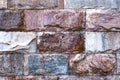 The wall is made of textured marble of different colors. Royalty Free Stock Photo