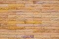 Wall made from yellow sandstone bricks, abstract background Royalty Free Stock Photo