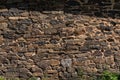 Wall of many stones. Stone wall. Embossed texture of stones