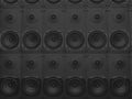 Wall of matte black bass music speakers