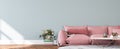 Wall mockup in modern living room design, pink sofa and white flower vase on empty interior background