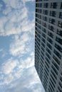 The wall of a modern building against a blue sky Royalty Free Stock Photo